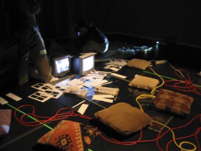 Pillows and monitors on ground