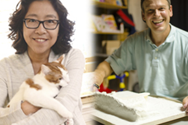 Woman and man, woman holding cat